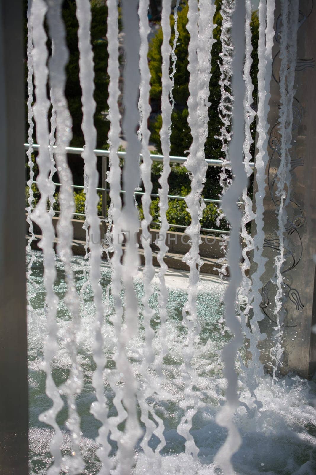 The fountains gushing sparkling water in a pool in a park