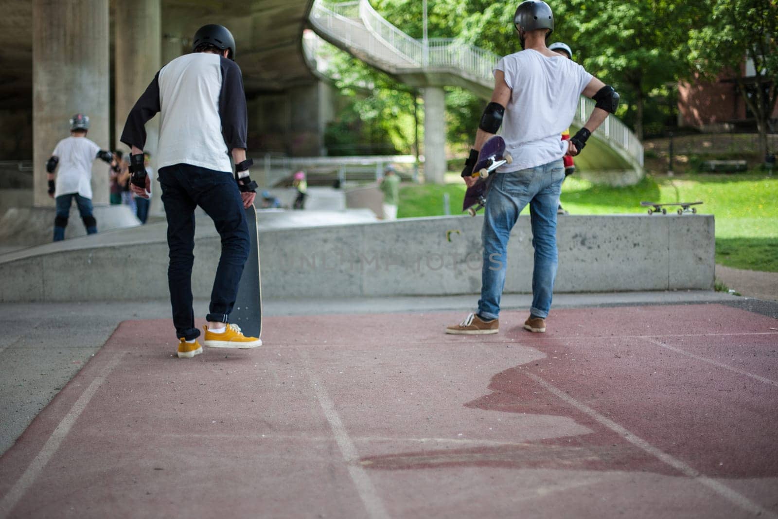 Powerful funny young guys are trained in a skate park Stockholm, Sweden. Leisure, playing, trick