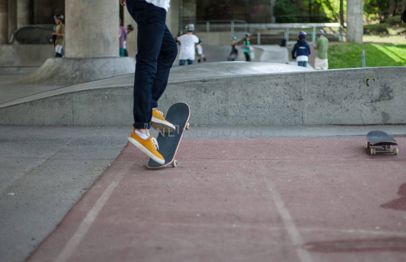 Powerful funny young guys are trained in a skate park Stockholm, Sweden. Leisure, playing, trick