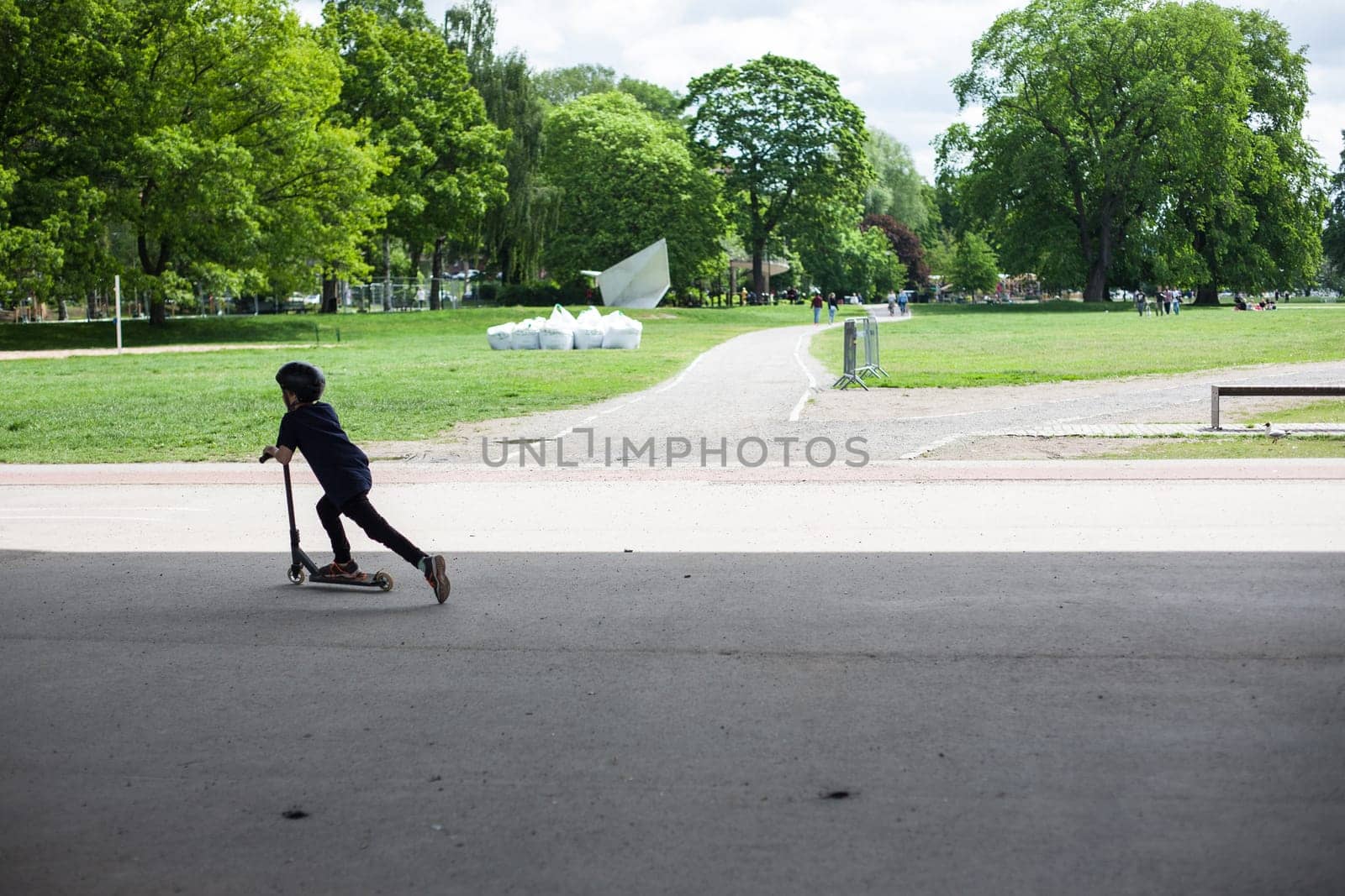 Powerful funny young guys are trained in a skate park Stockholm, Sweden. Leisure, playing, trick
