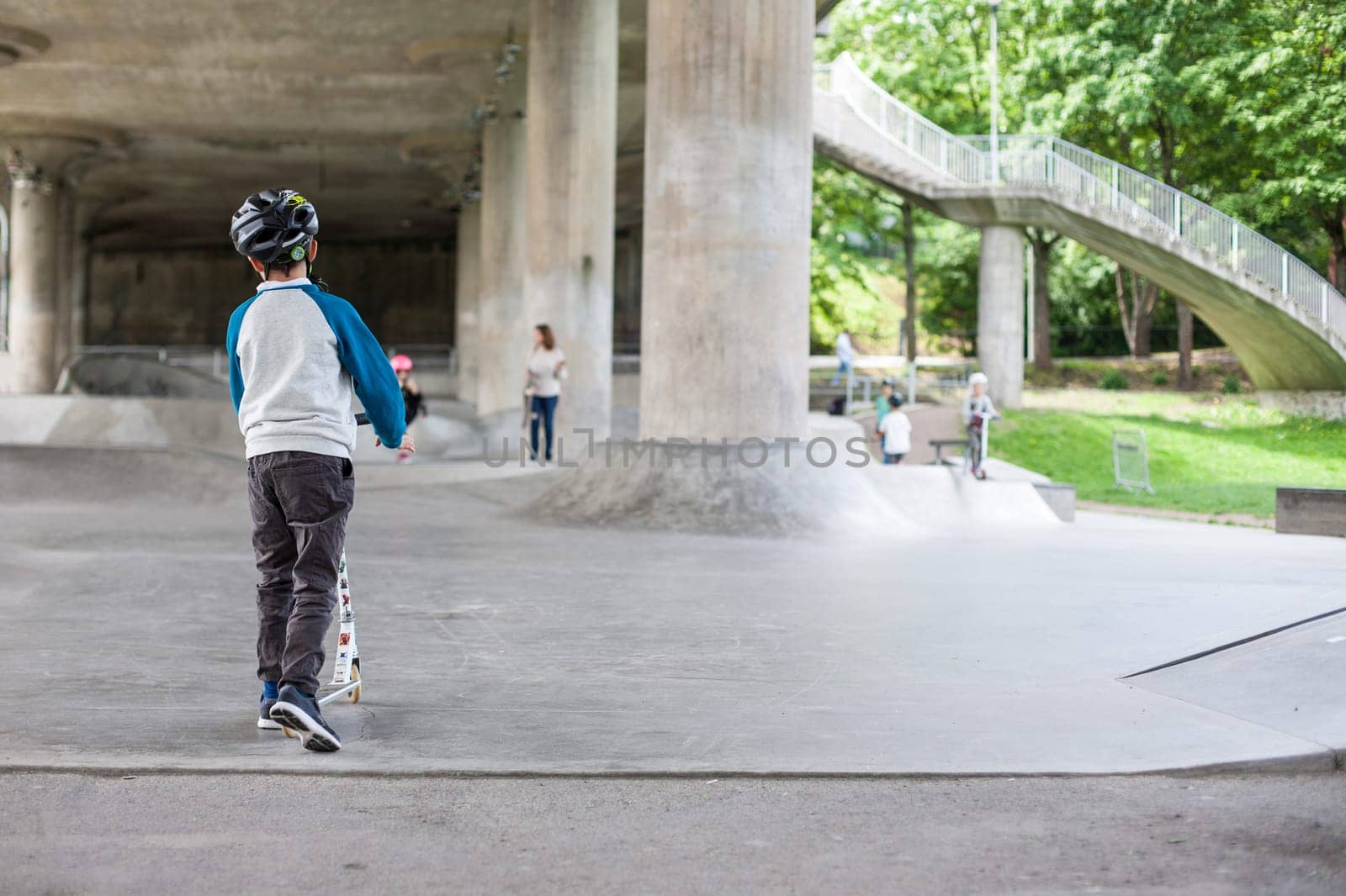 Powerful funny young guys are trained in a skate park Stockholm, Sweden. Leisure, playing, trick