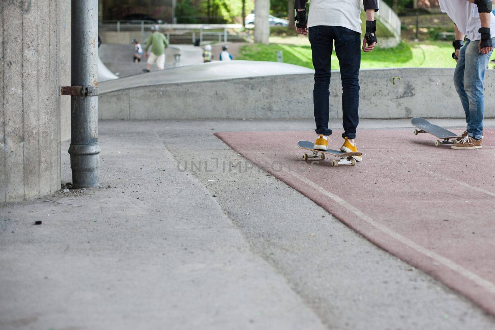 Powerful funny young guys are trained in a skate park Stockholm, Sweden. Leisure, playing, trick