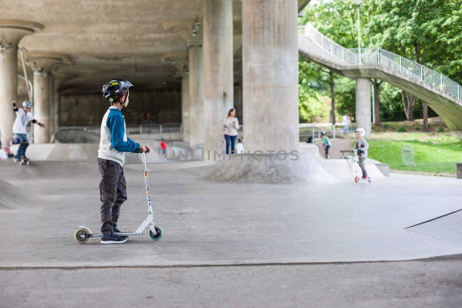 Powerful funny young guys are trained in a skate park Stockholm, Sweden. Leisure, playing, trick