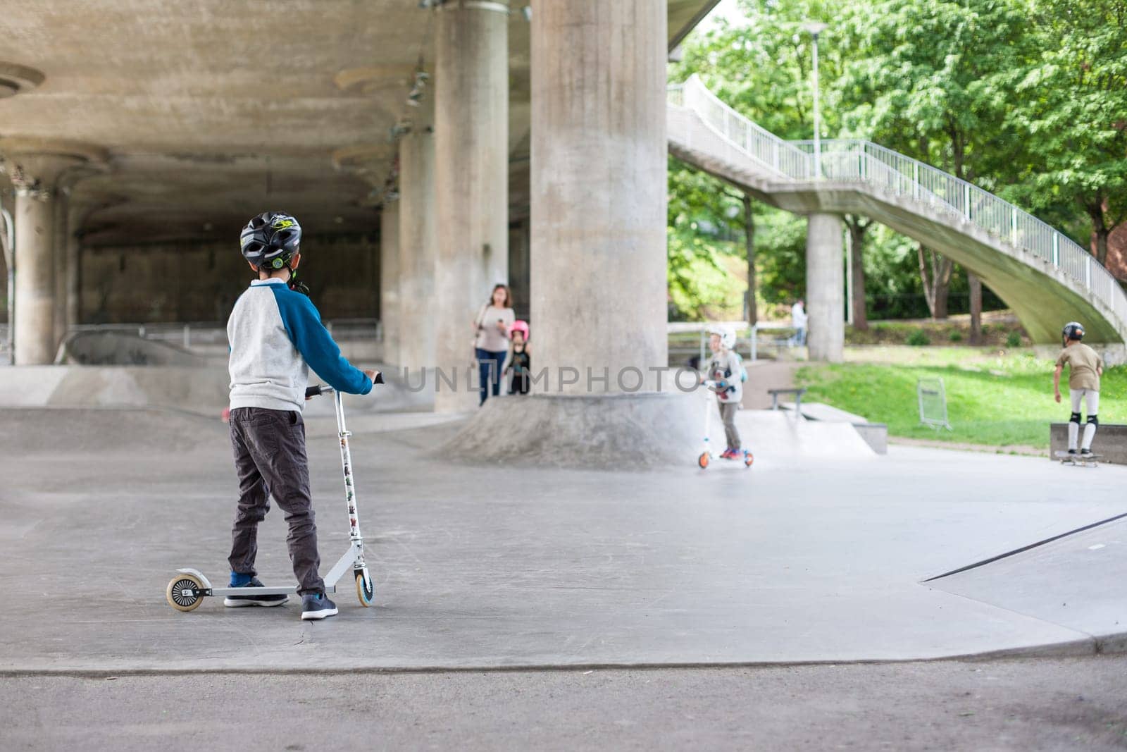 Powerful funny young guys are trained in a skate park Stockholm, Sweden. Leisure, playing, trick