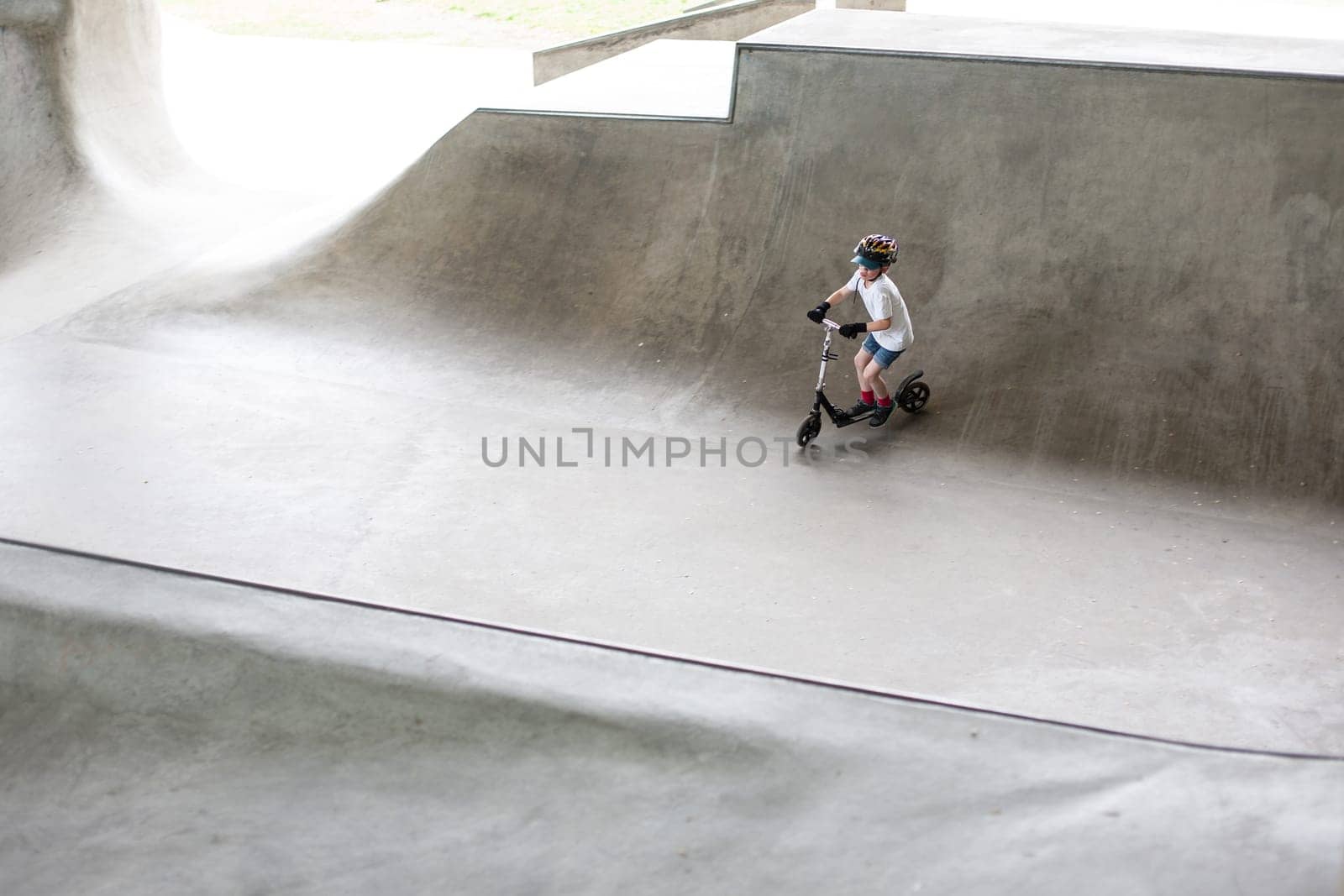 Powerful funny young guys are trained in a skate park Stockholm, Sweden. Leisure, playing, trick