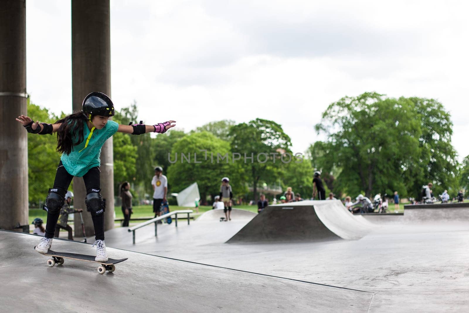 Stockholm, Sweden - July 11, 2017 : Powerful funny young guys are trained in a skate park. Leisure, playing, trick