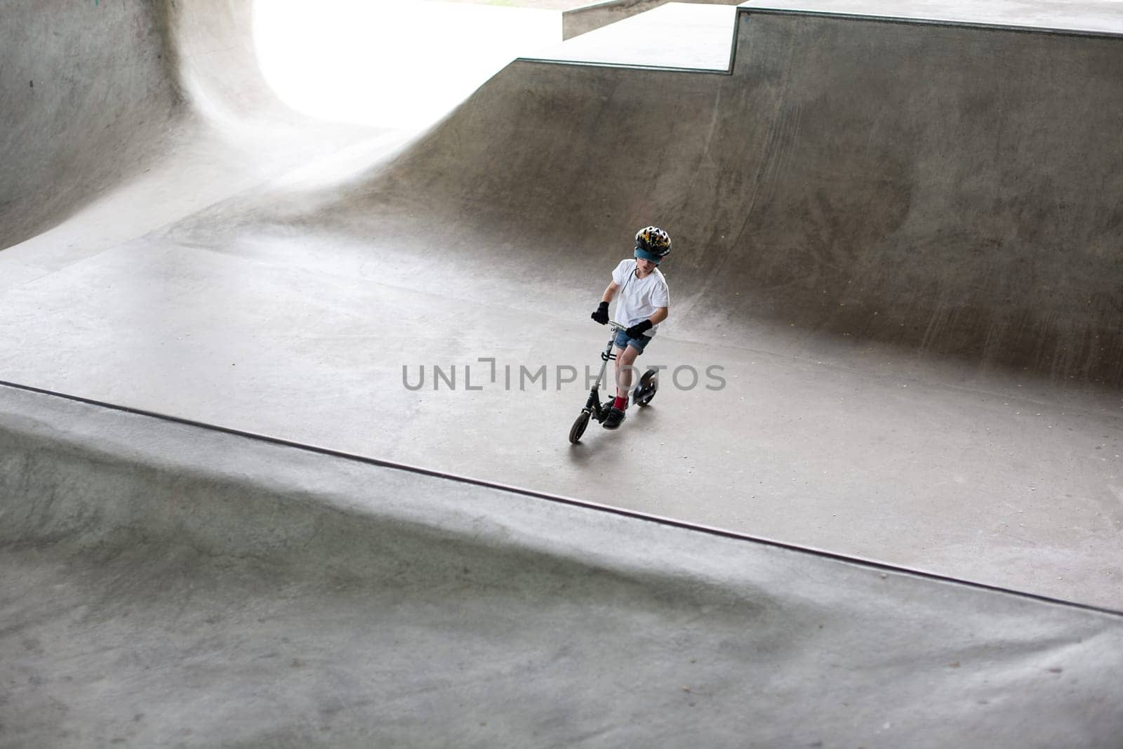 Powerful funny young guys are trained in a skate park Stockholm, Sweden. Leisure, playing, trick