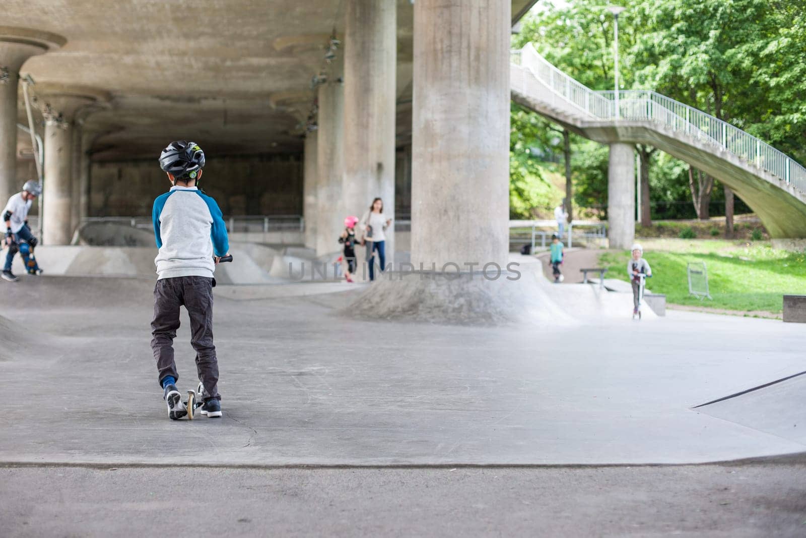 Powerful funny young guys are trained in a skate park Stockholm, Sweden. Leisure, playing, trick
