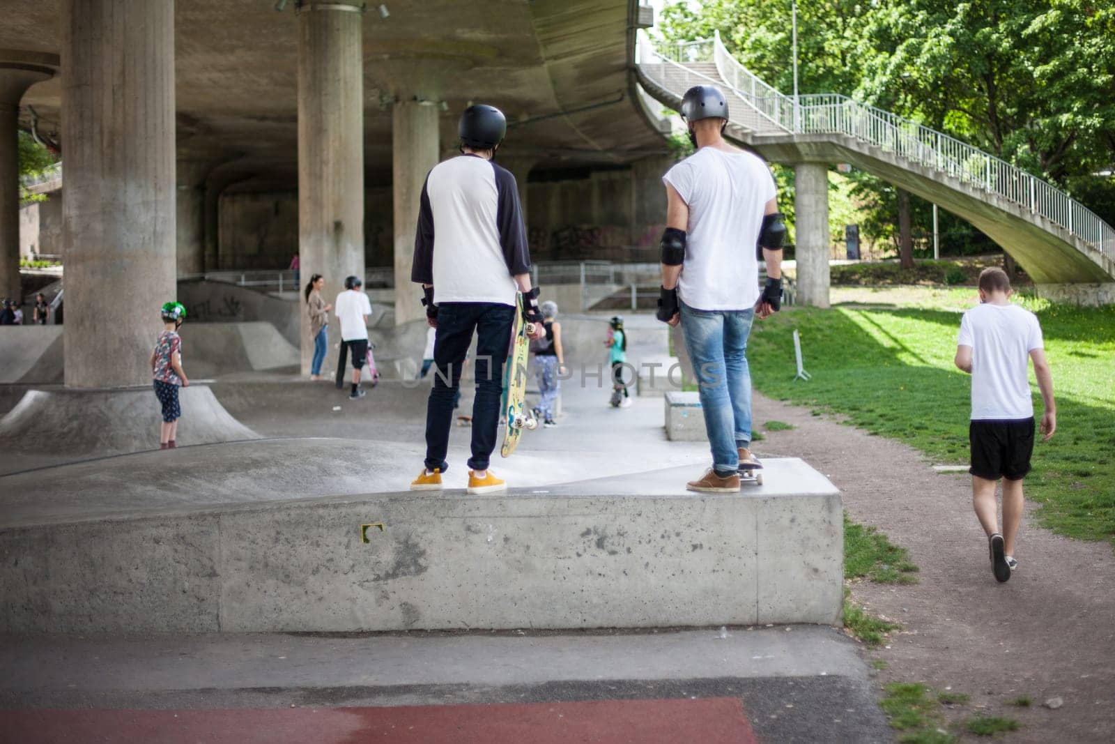 Powerful funny young guys are trained in a skate park Stockholm, Sweden. Leisure, playing, trick