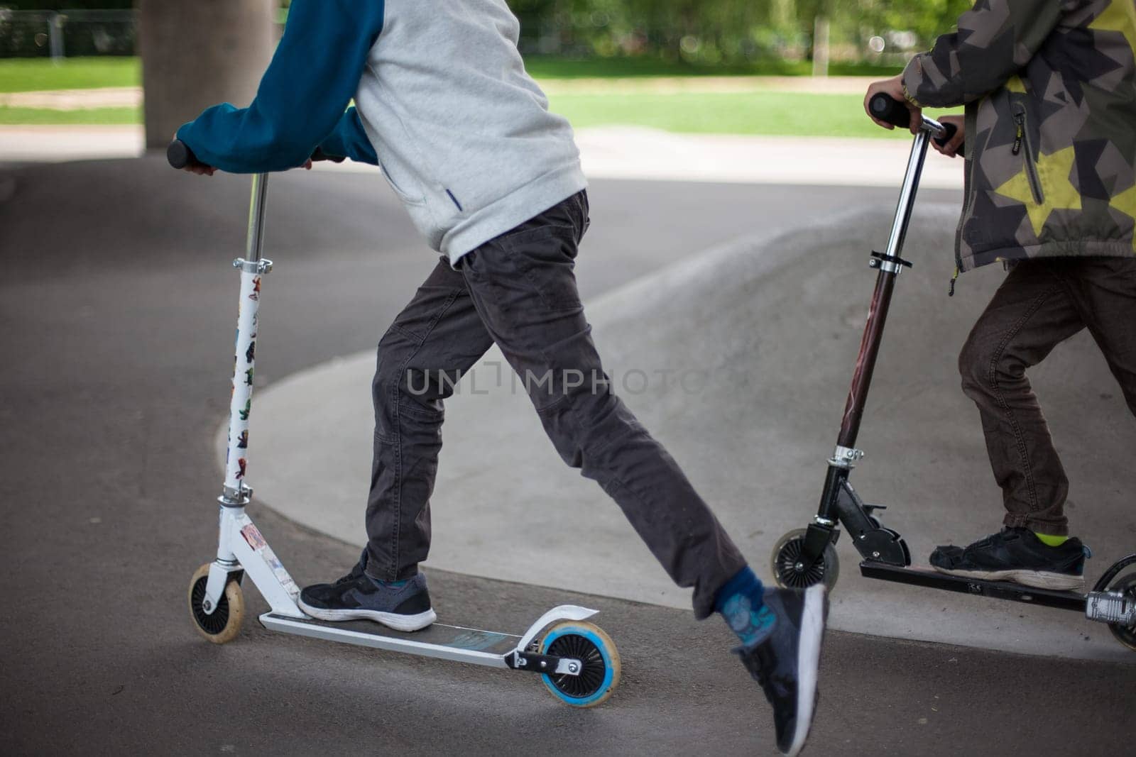 Powerful funny young guys are trained in a skate park Stockholm, Sweden. Leisure, playing, trick