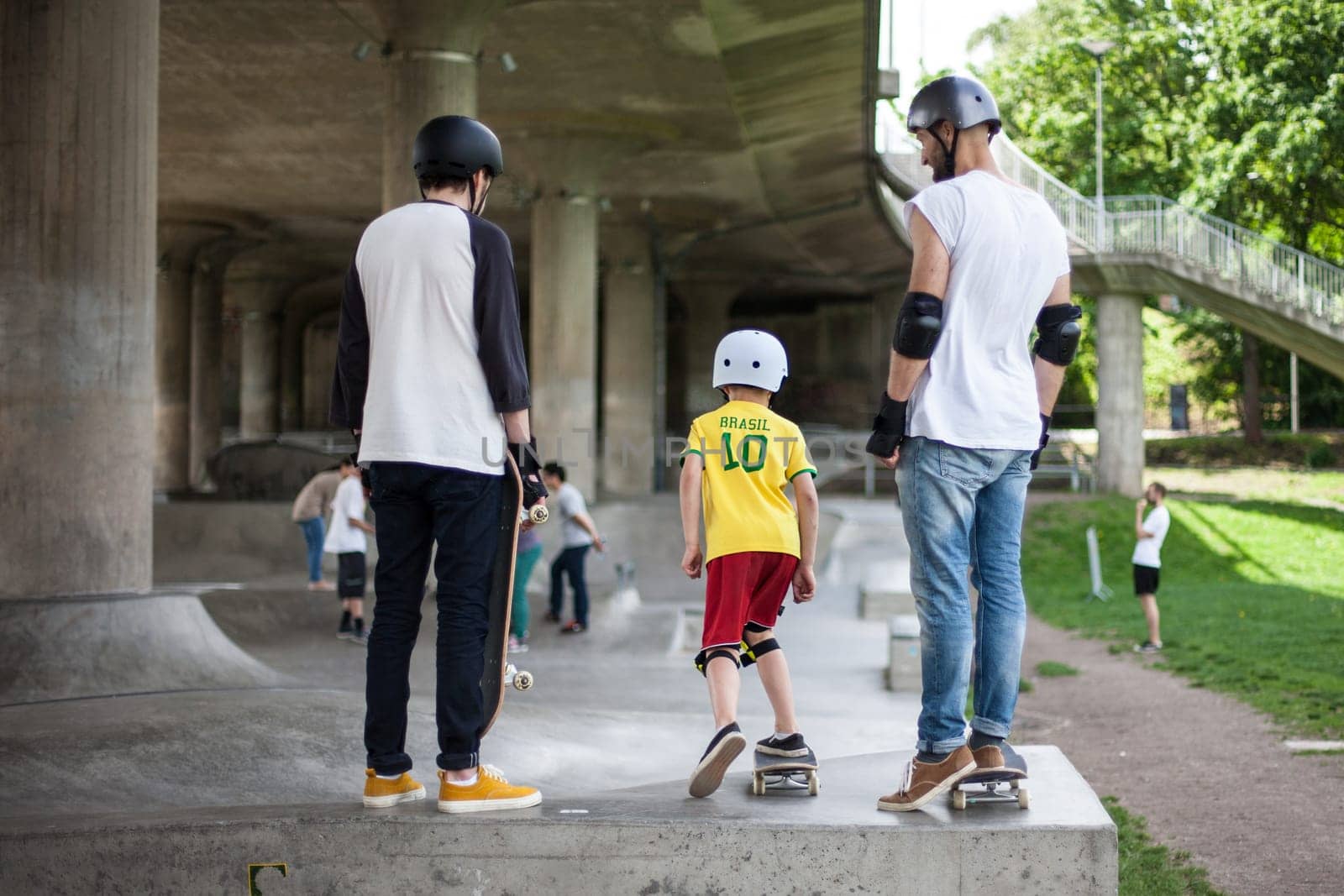Powerful funny young guys are trained in a skate park Stockholm, Sweden. Leisure, playing, trick