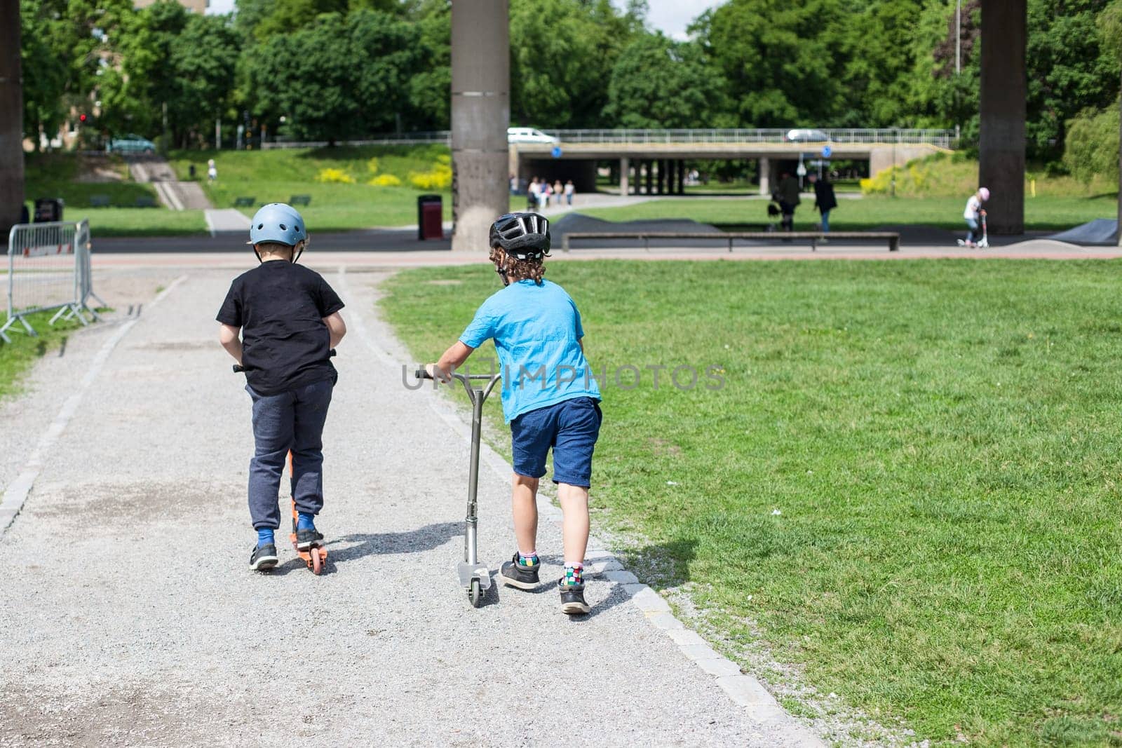 Powerful funny young guys are trained in a skate park Stockholm, Sweden. Leisure, playing, trick
