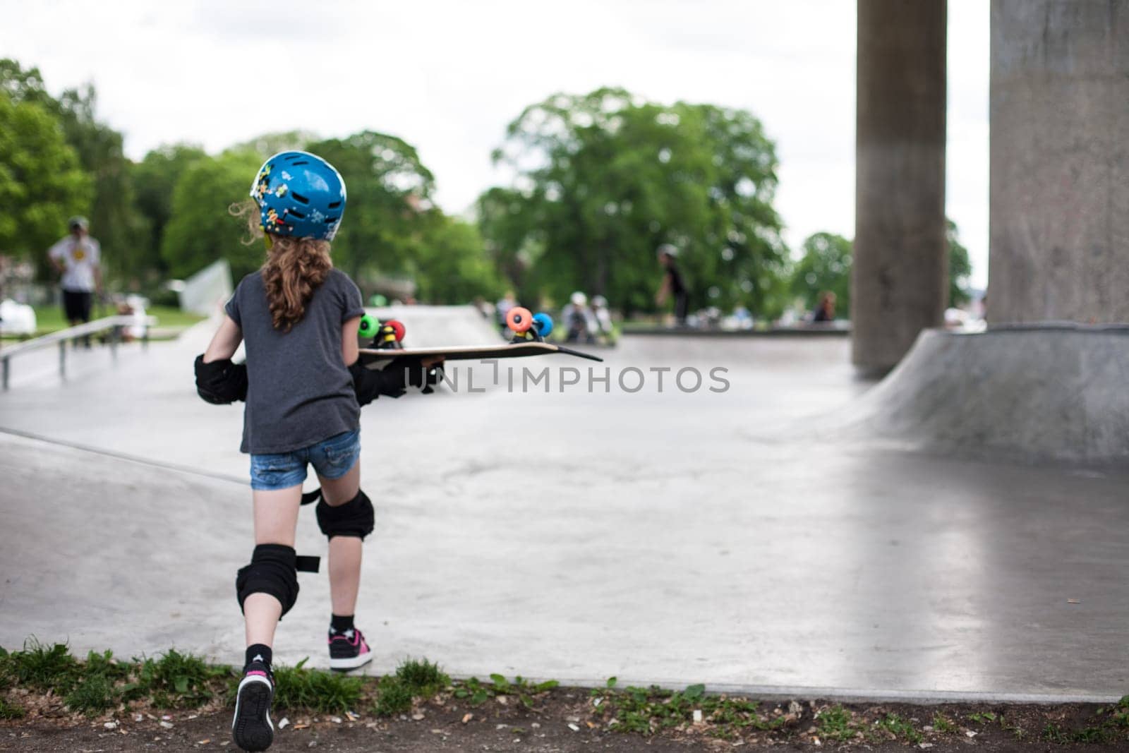 Powerful funny young guys are trained in a skate park Stockholm, Sweden. Leisure, playing, trick