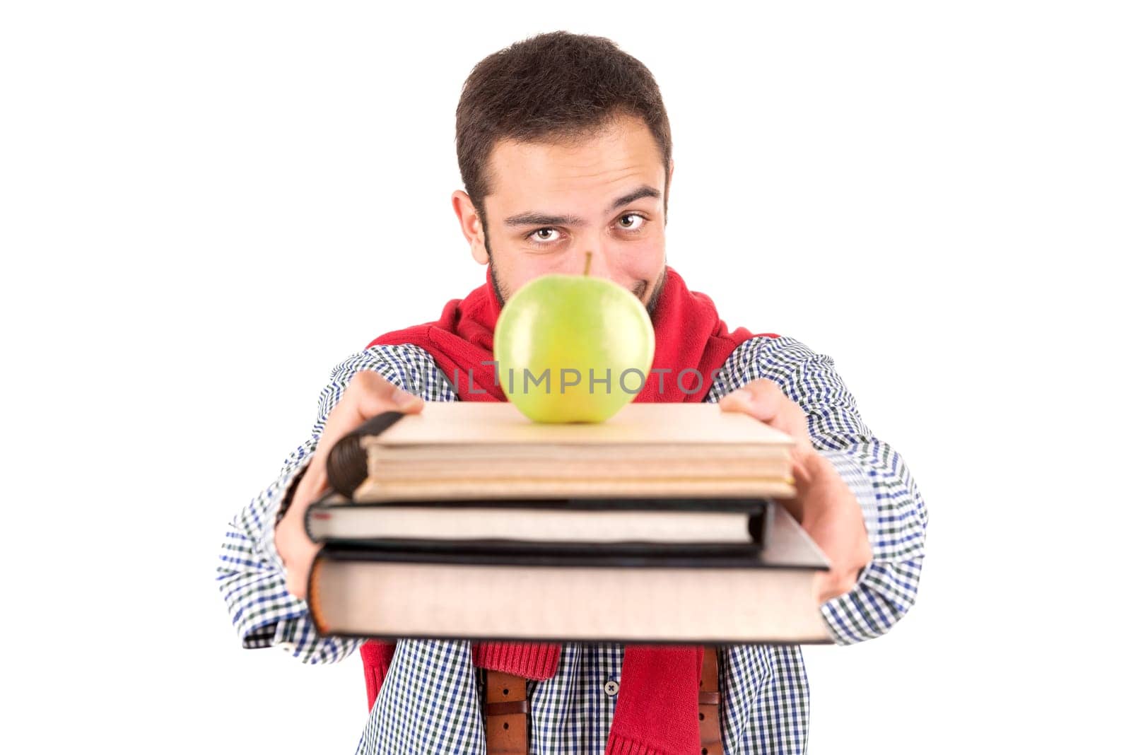 Young nerd student posing with books and apple isolated in a white background