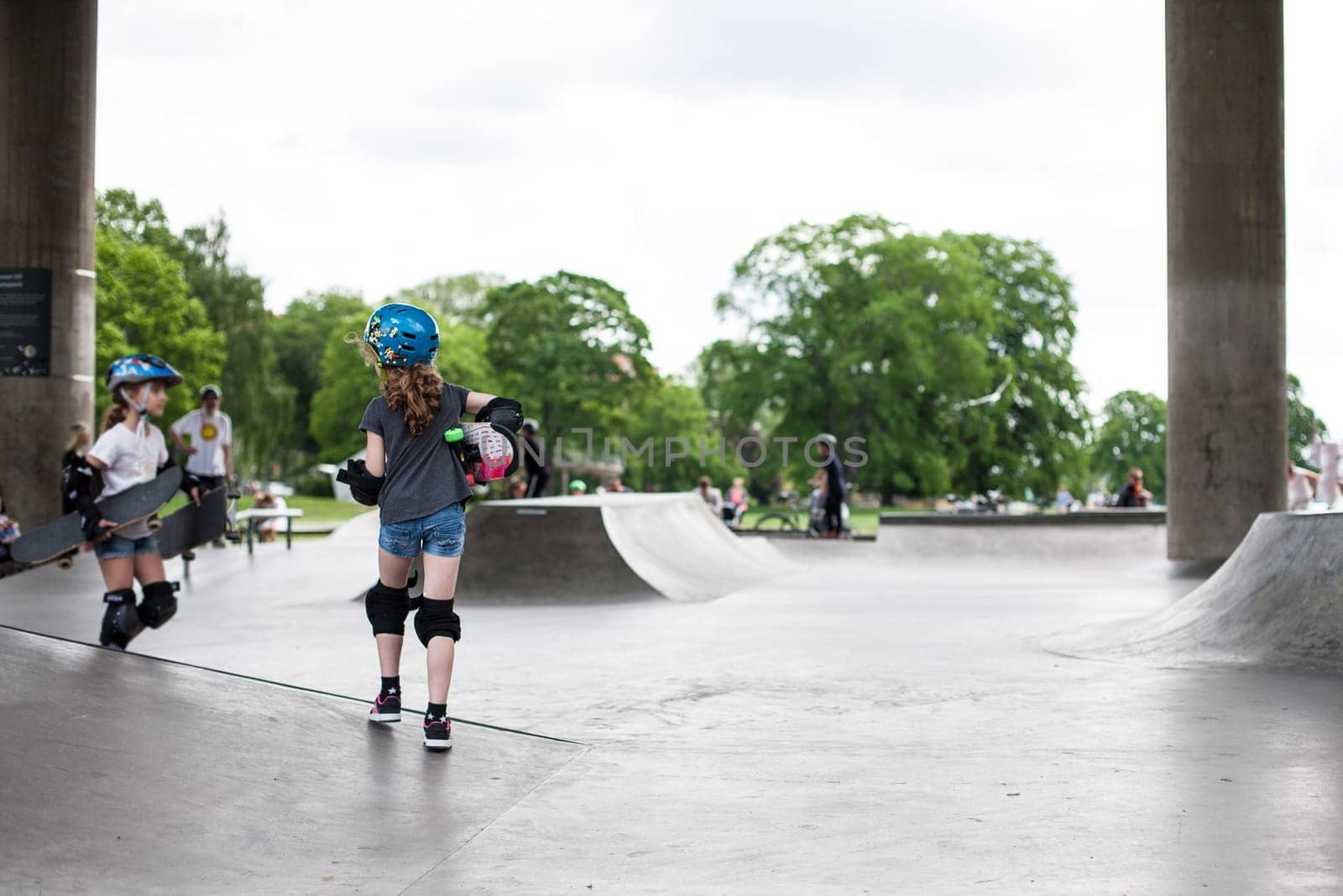 Powerful funny young guys are trained in a skate park Stockholm, Sweden. Leisure, playing, trick