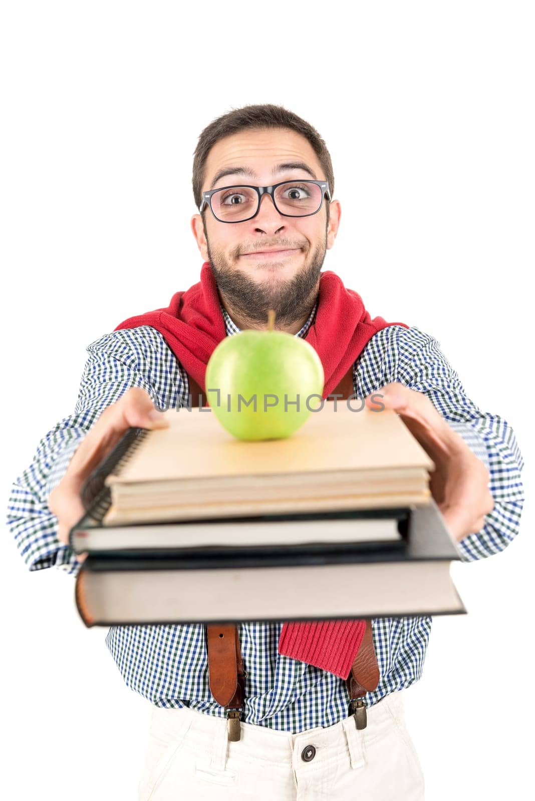 Young nerd student posing with books and apple isolated in a white background
