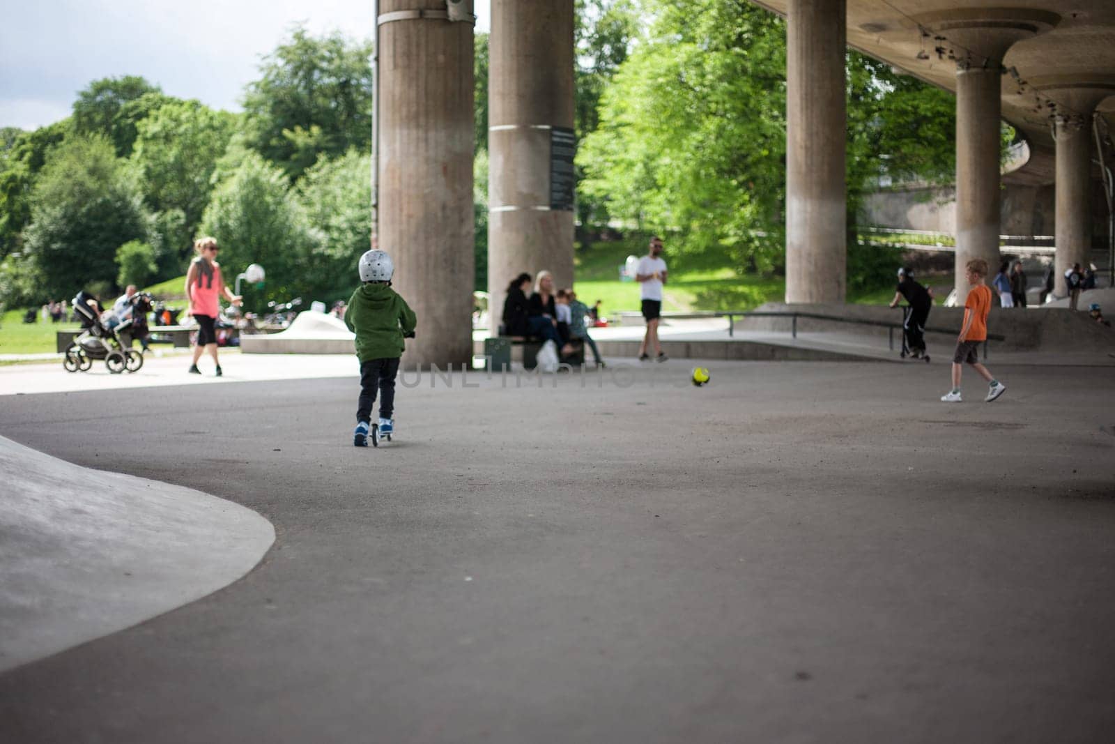 Powerful funny young guys are trained in a skate park Stockholm, Sweden. Leisure, playing, trick