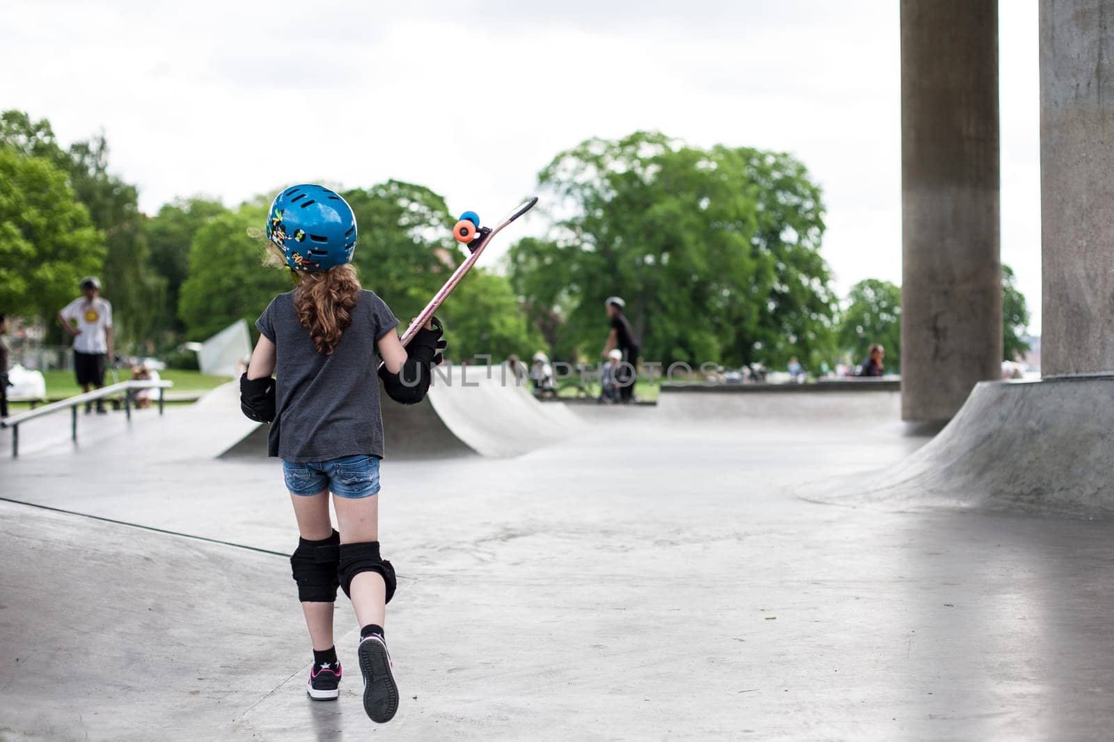 Powerful funny young guys are trained in a skate park Stockholm, Sweden. Leisure, playing, trick