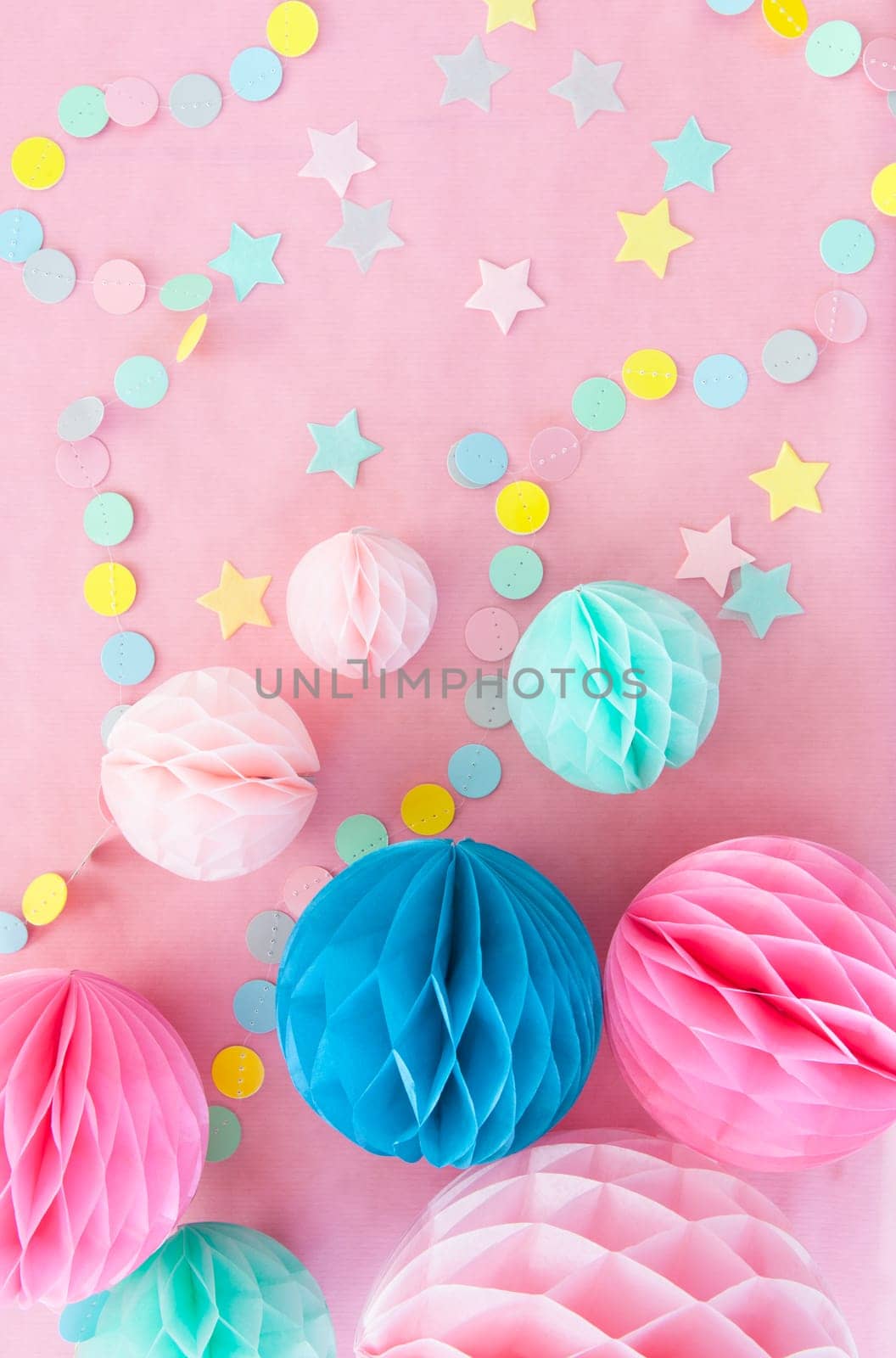 Colorful decoration for a party on a pink background