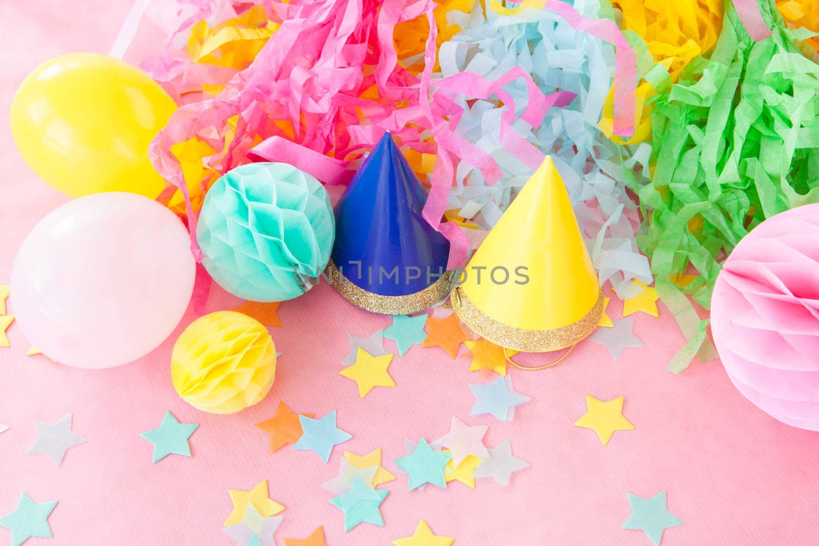 Colorful decoration,confetti for a party on a pink background