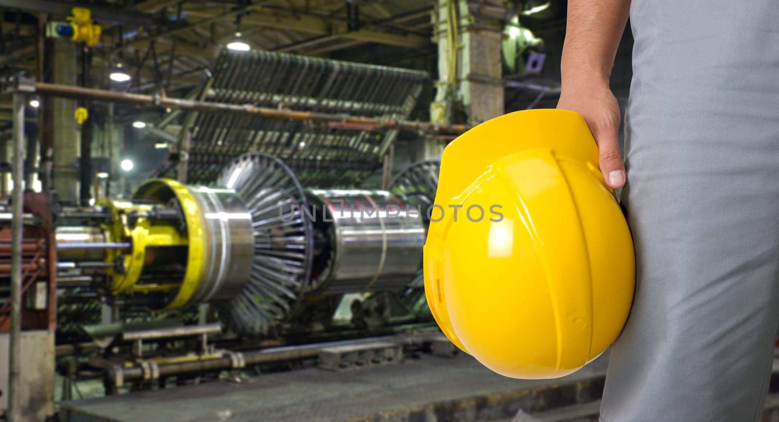 Worker with safety helmet at industrial factory