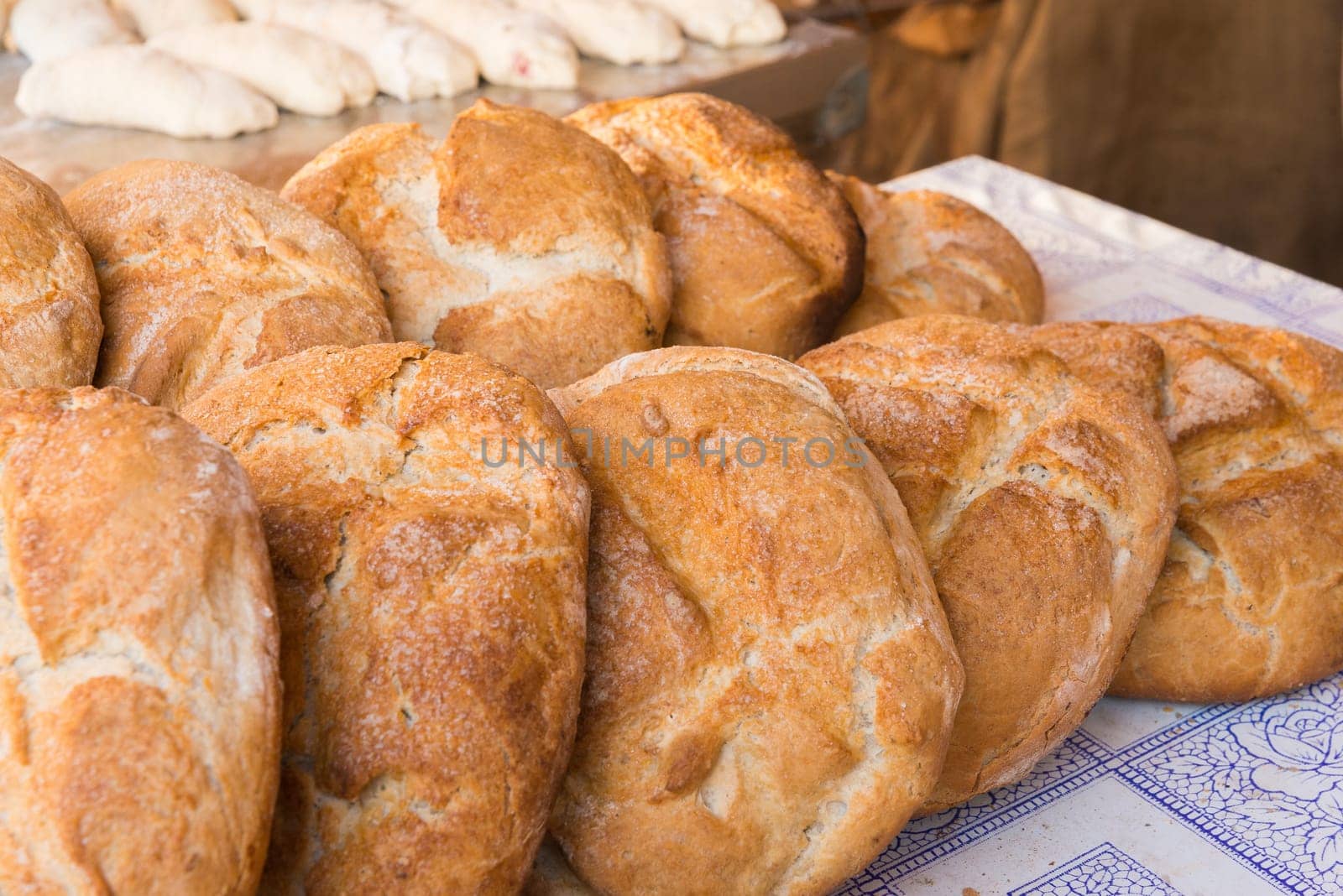 Rustic bread loaves on a market stall, Badajoz