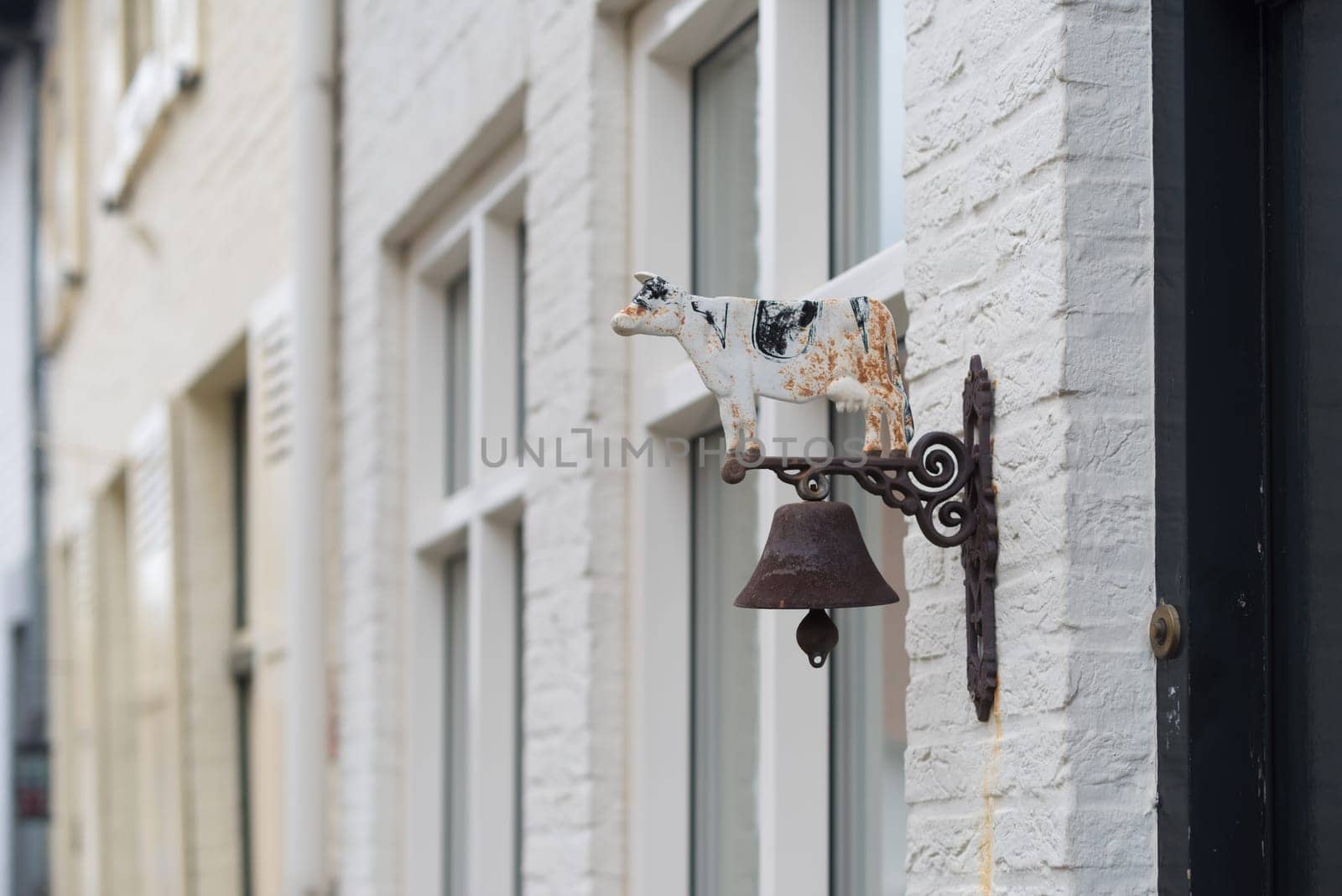 old vintage antique door bell with cow on it