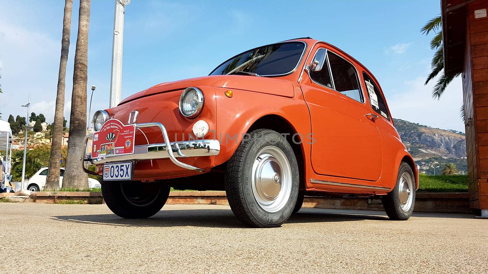 Menton, France - September 9, 2017: Old Red Fiat 500 L Parked on the Esplanade Francis Palmero in the City of Menton on the French Riviera