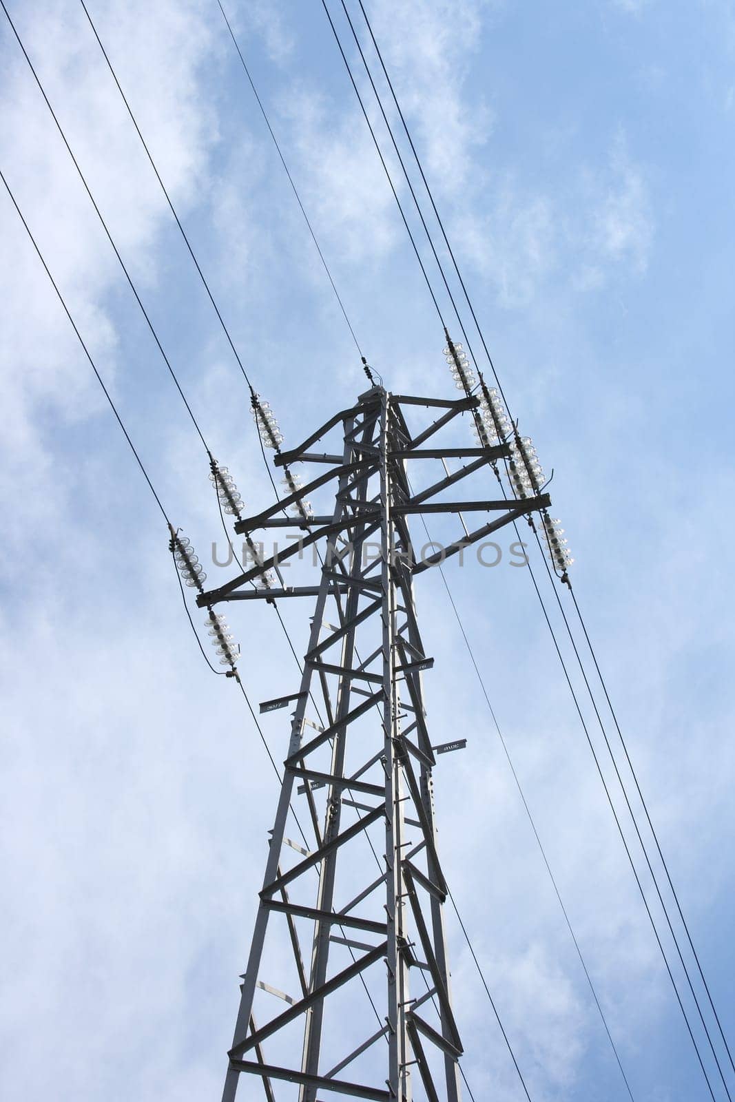 large transmission power pole,with blue sky background
