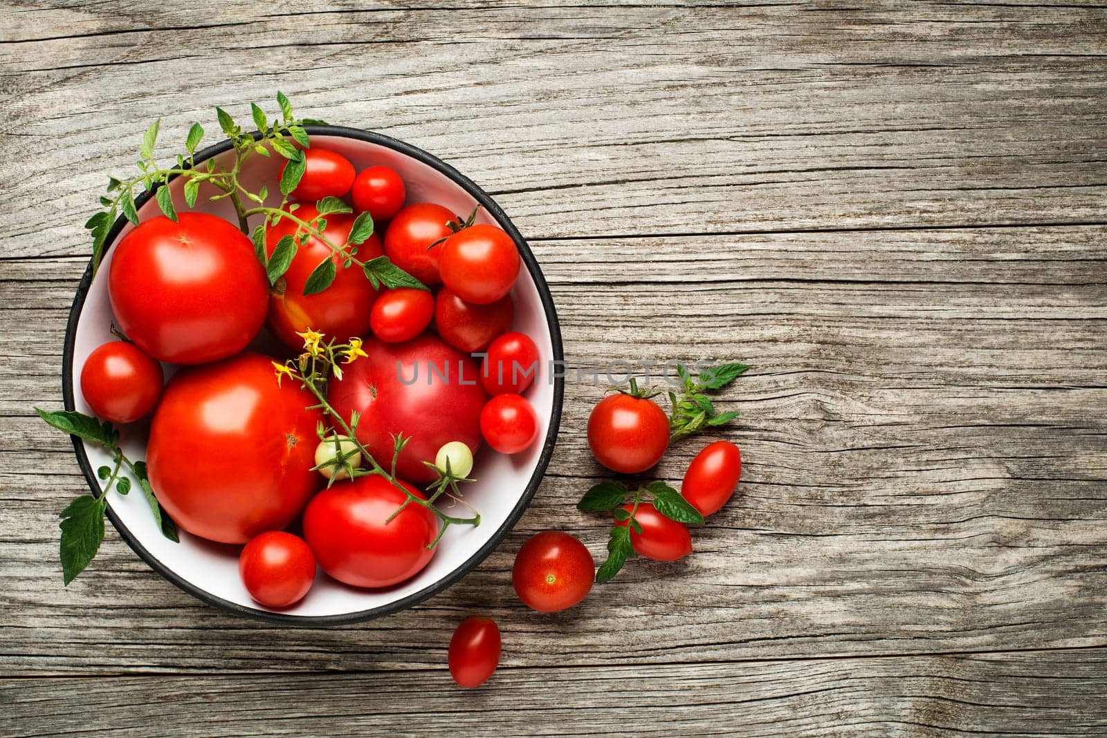 Fresh tomatoes on wooden background. Top view