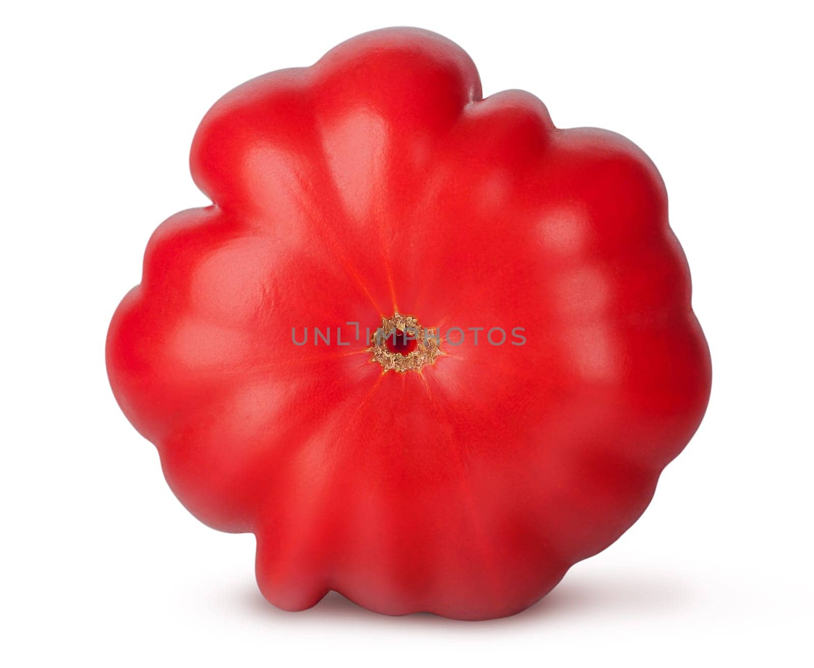 Fresh heirloom tomato bottom view isolated on white background