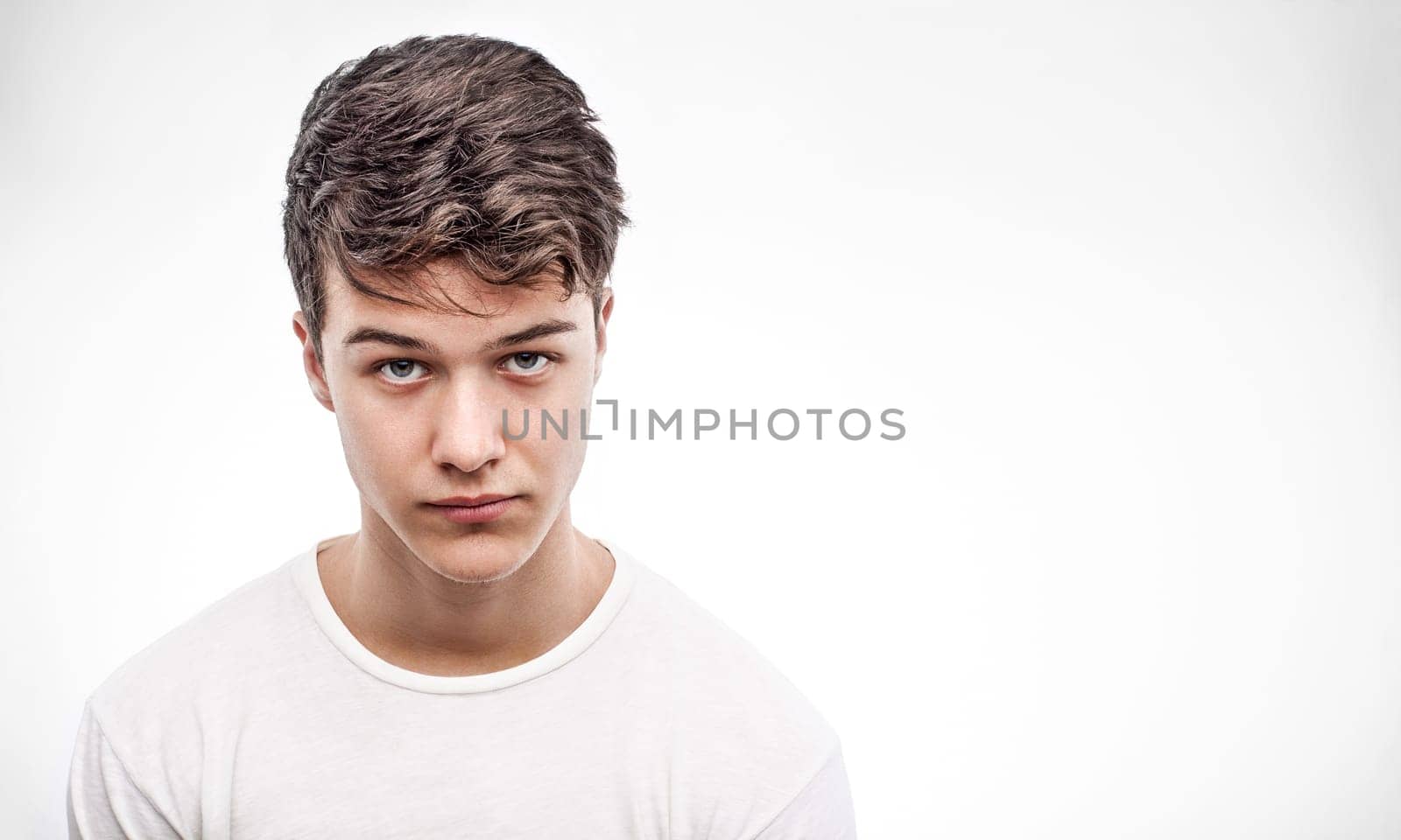 Young handsome man in red blouse looking ahead