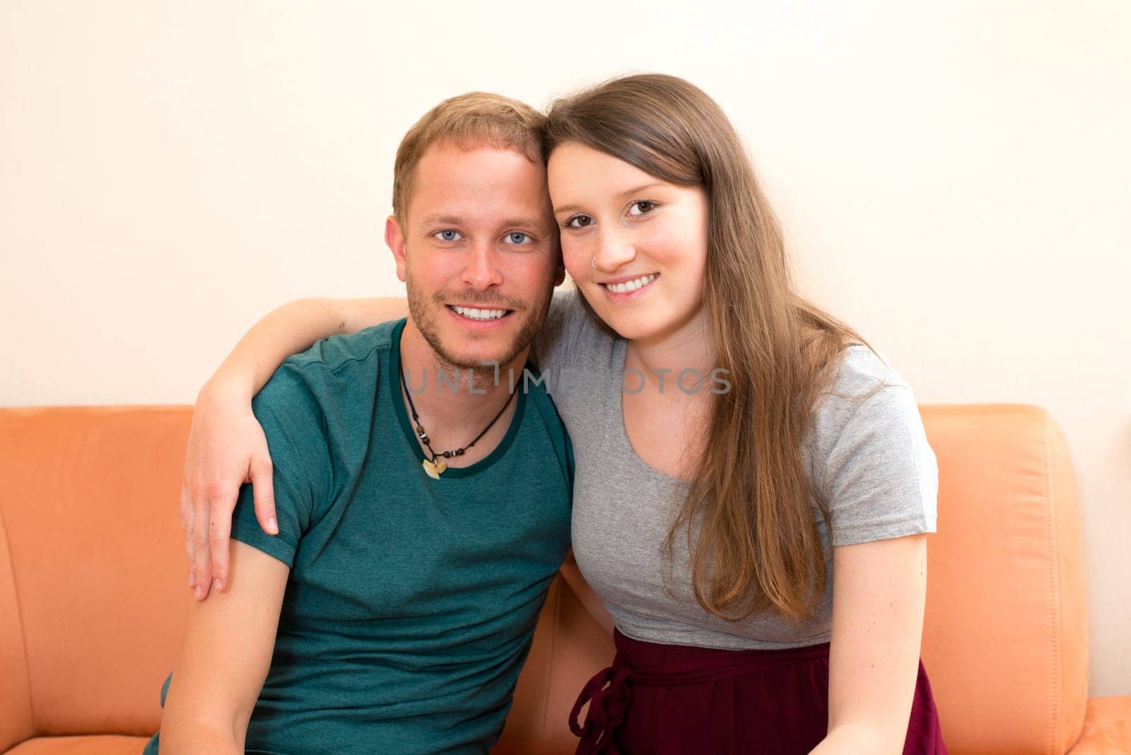 young man and woman at home in the living room