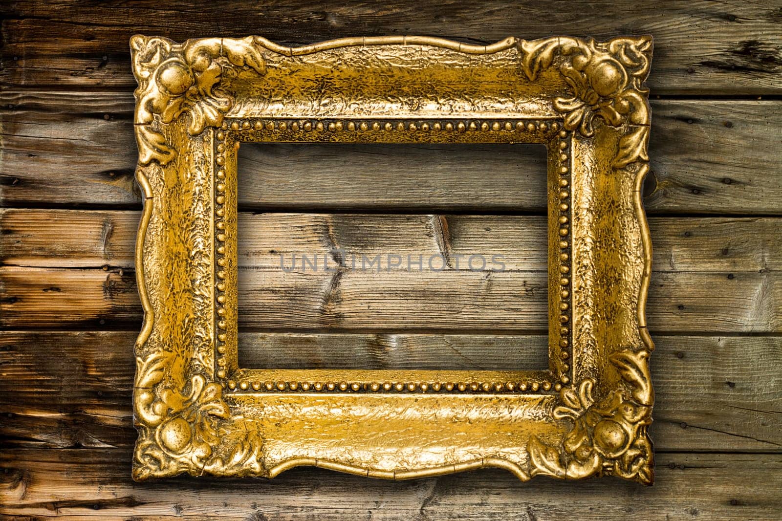 Big Old Gold Picture Frame on wooden background