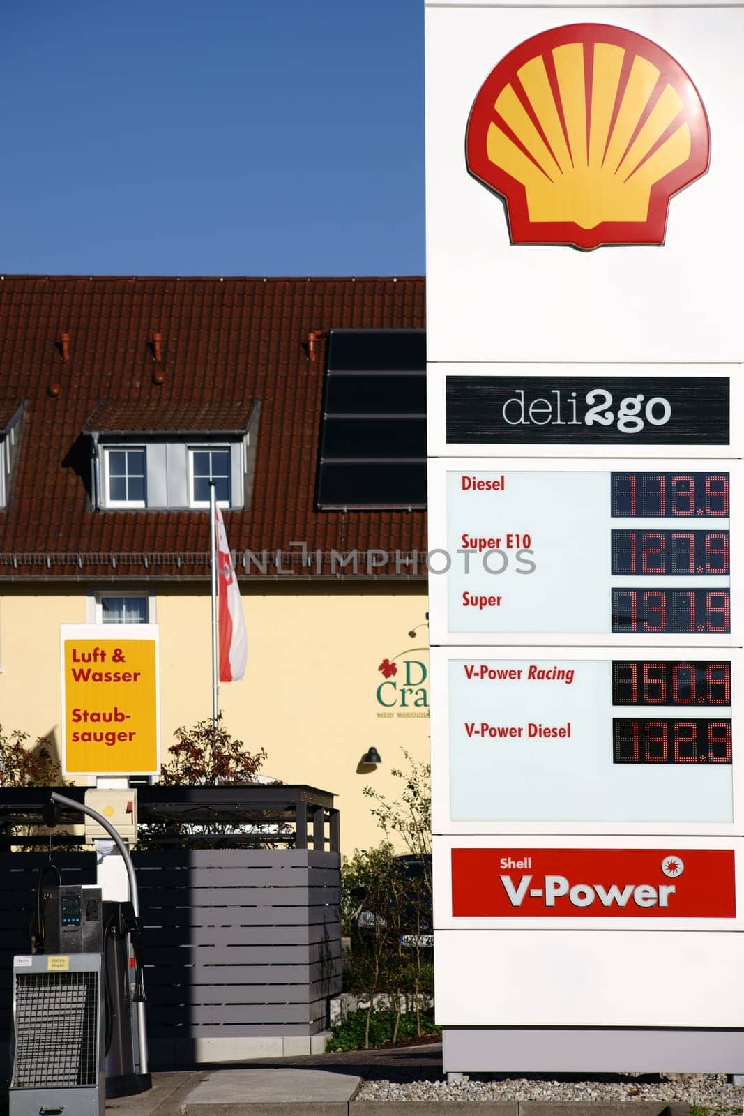 Nieder-Olm,Germany - October 14,2017: The price column of a Shell petrol station with an air and water column next door on 14 October 2017 in Nieder-Olm.