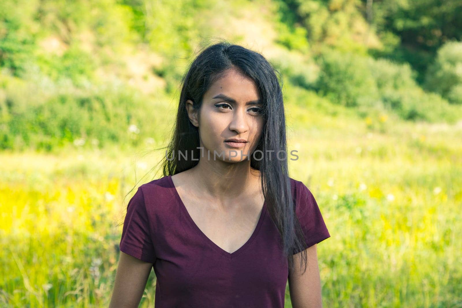 Portrait of a young woman with long black hair