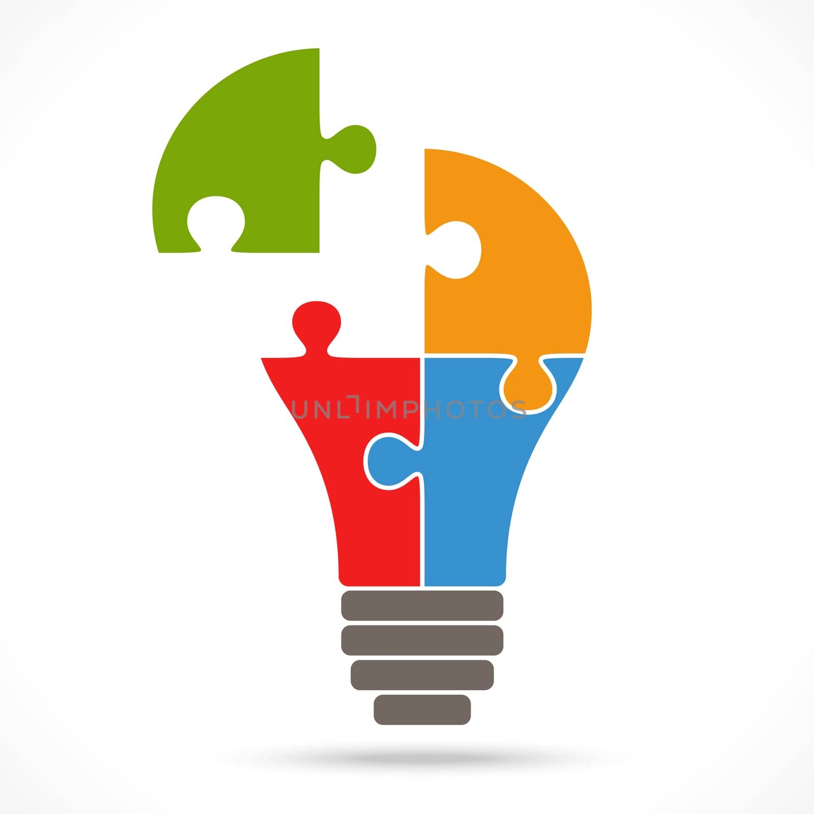 light bulb with four puzzle parts symbolizing teamwork ideas