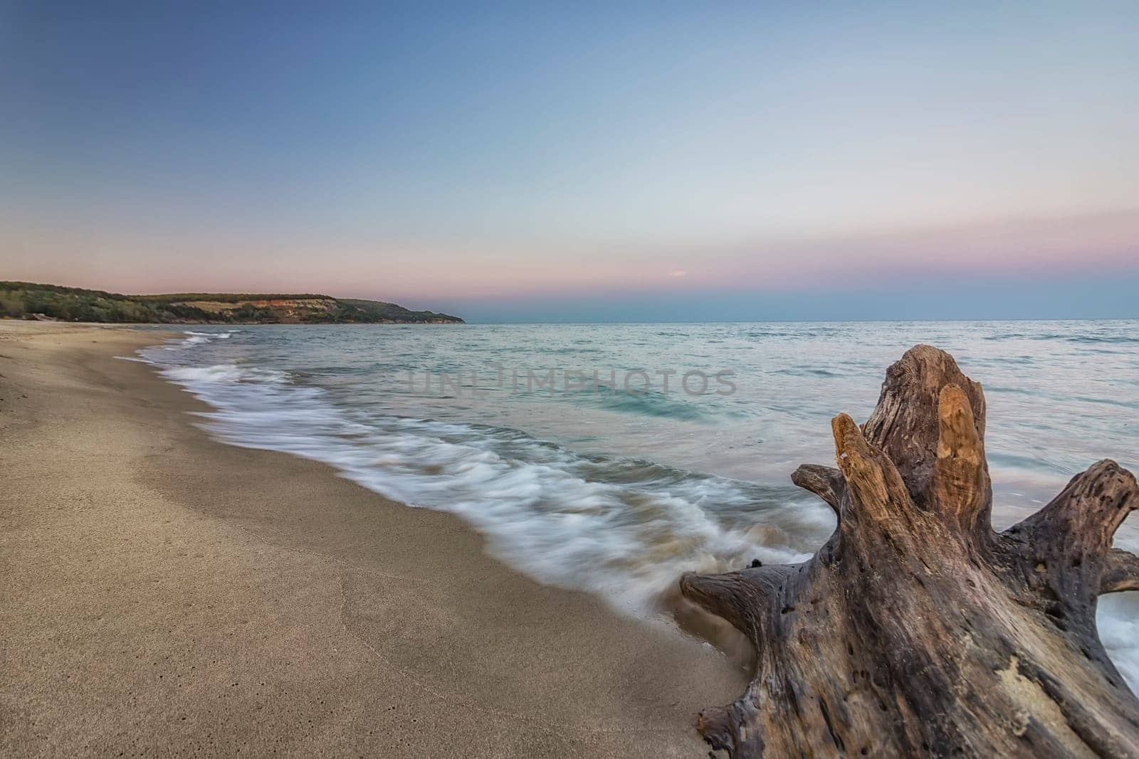 early morning on the beach with waves spill