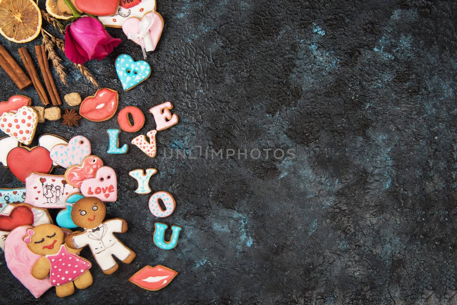 Gingerbreads for love or marrige on dark concrete background