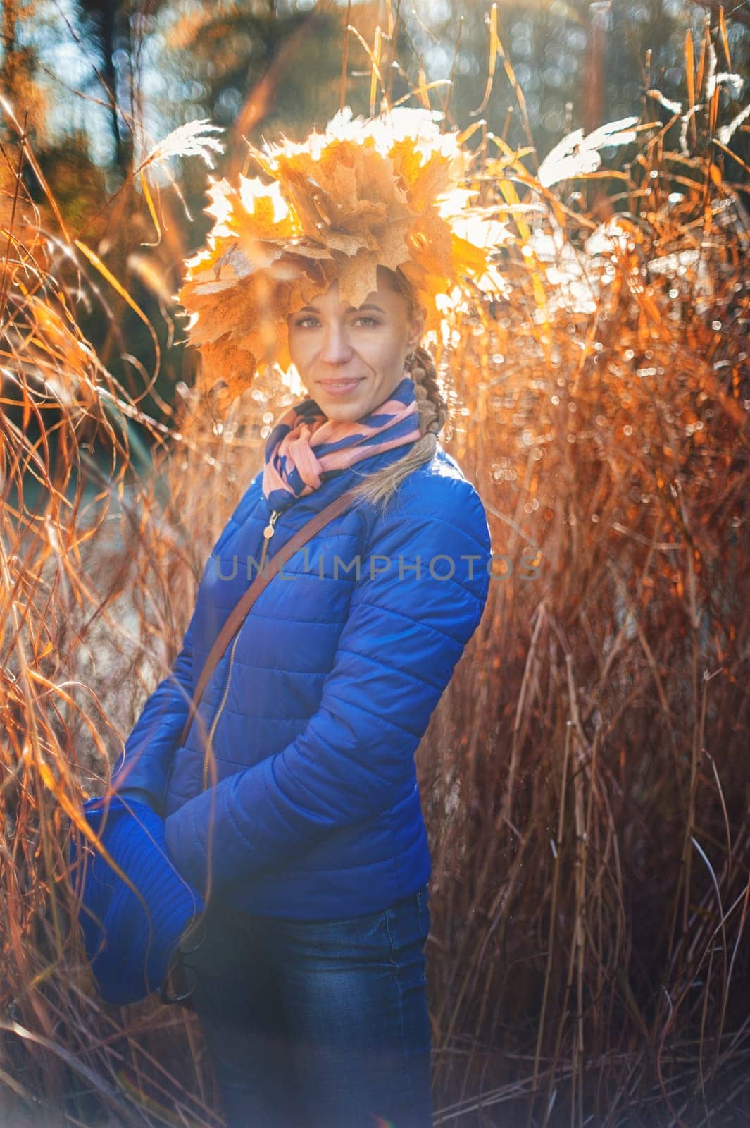 Beauty woman at autumn park in sunny beauty day