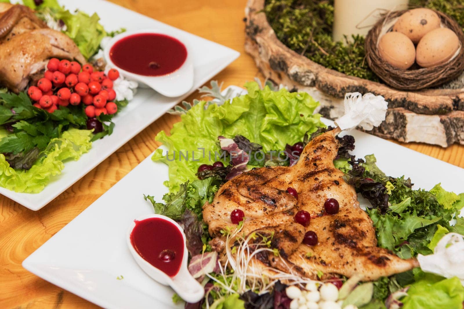quail roasted with sweet and sour cranberry sauce decorated with rowanberry