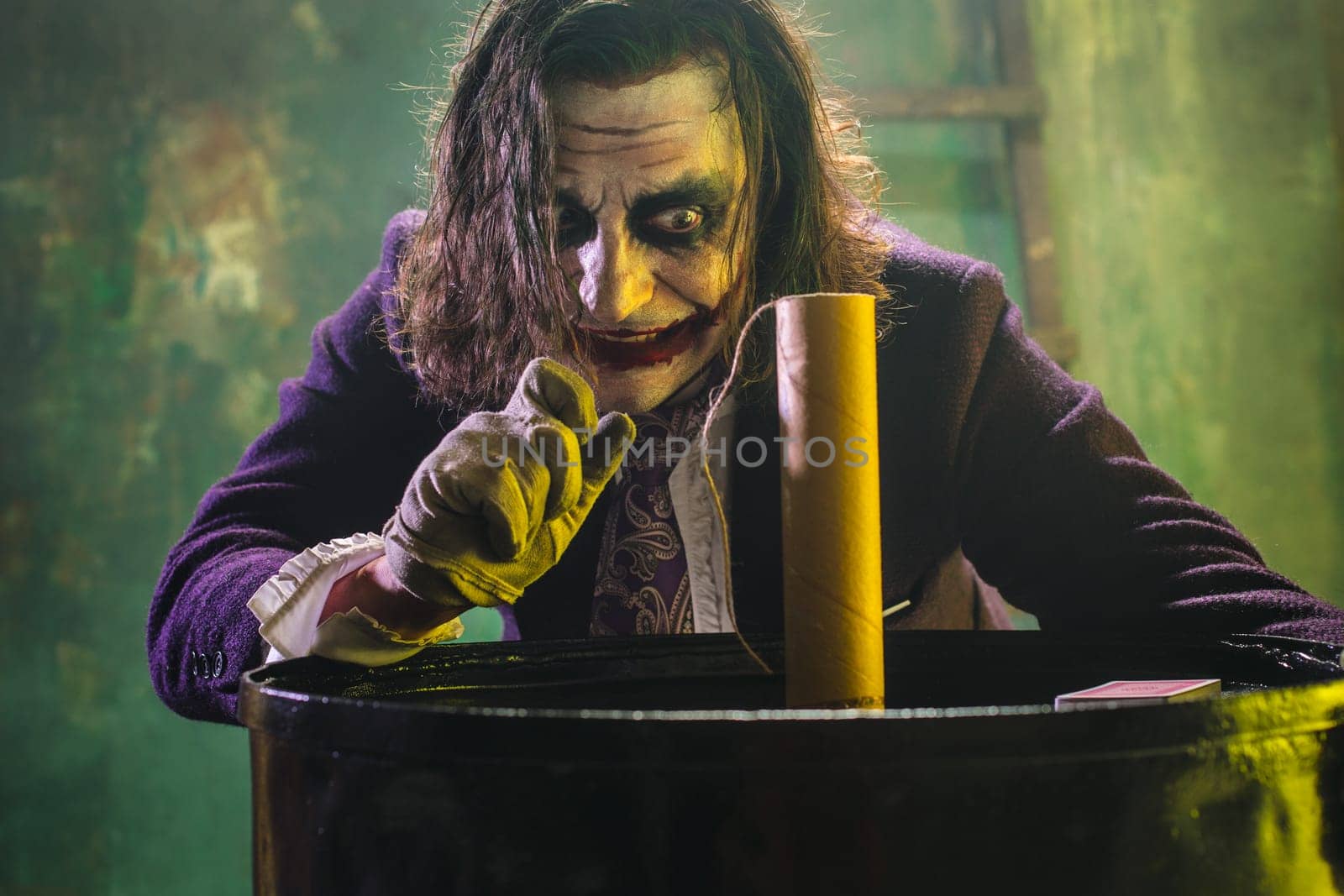 Bloody Halloween theme: The crazy maniak face on dark studio background