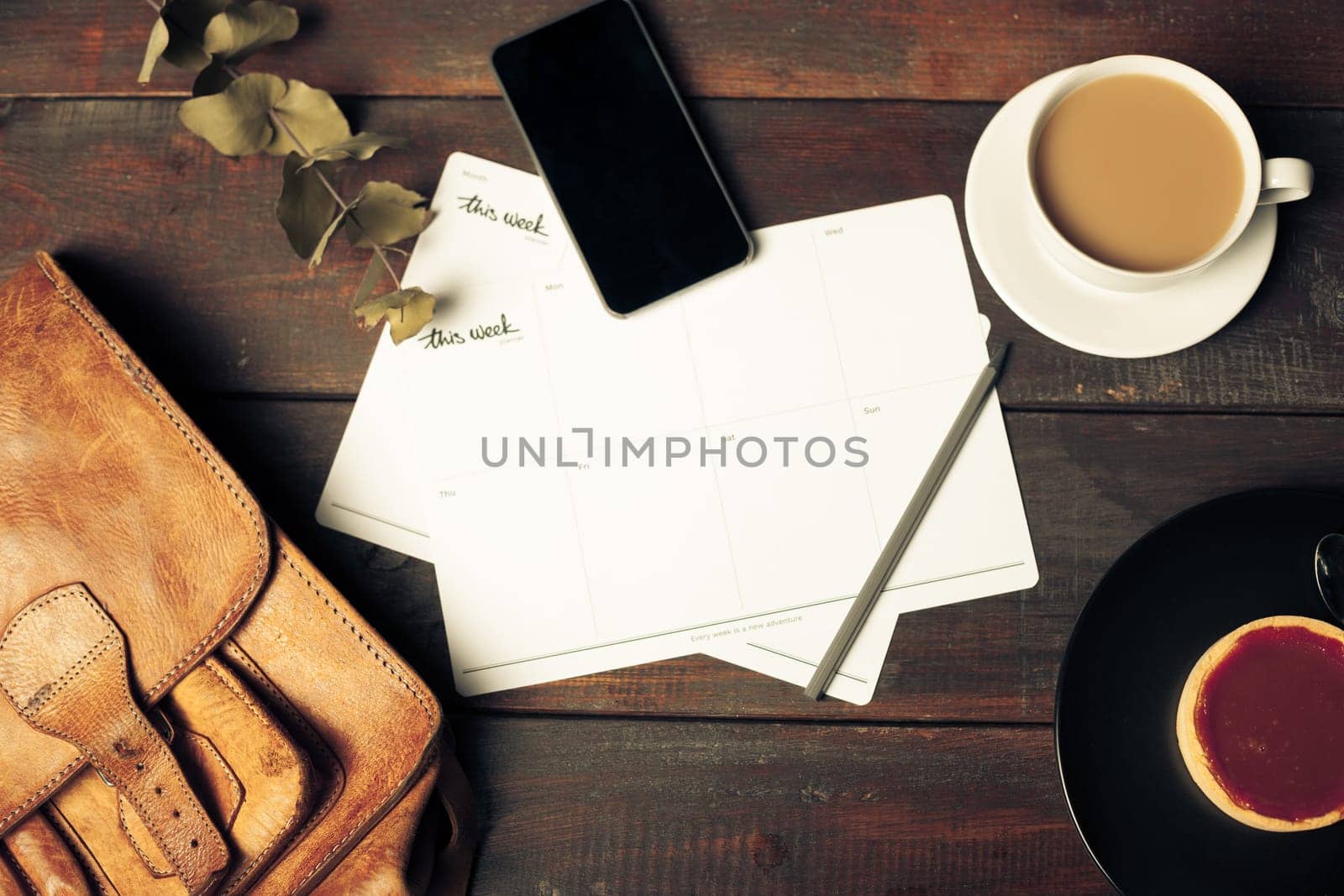 Opened craft paper envelope , autumn leaves and coffee on rustic wooden table