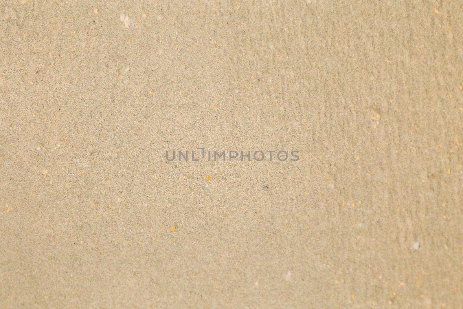 Closeup of sand pattern of a beach in the summer