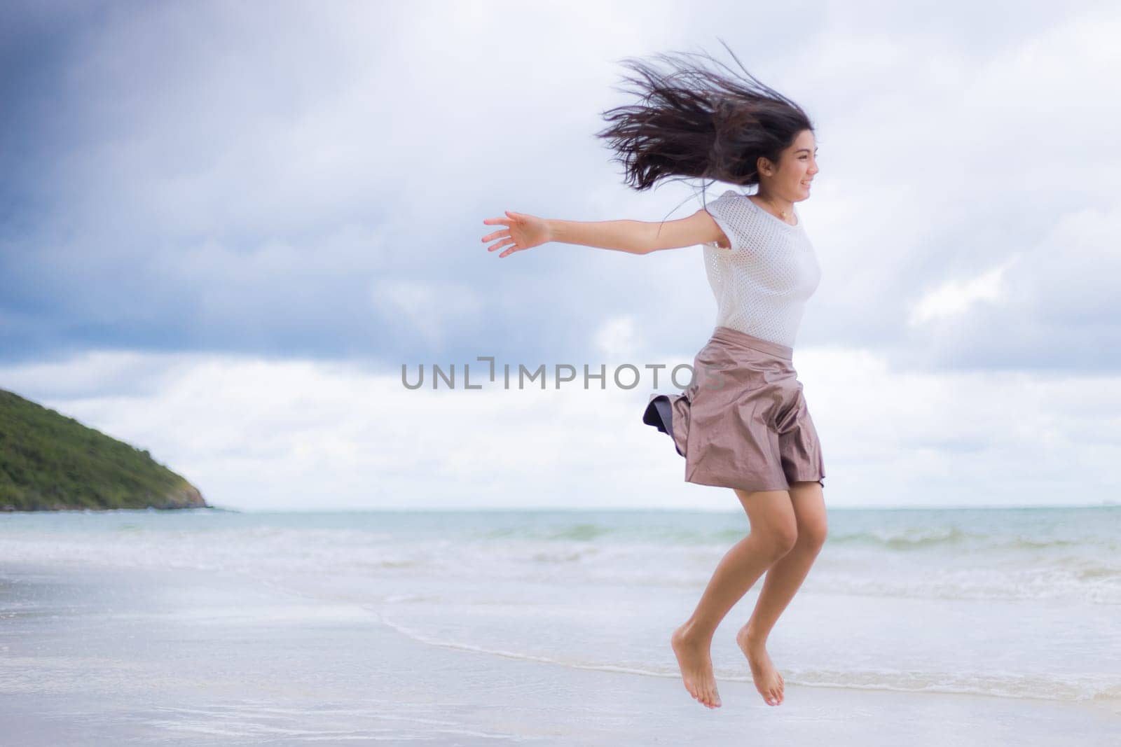 Beautiful Asian woman vacation on beach of Thailand.