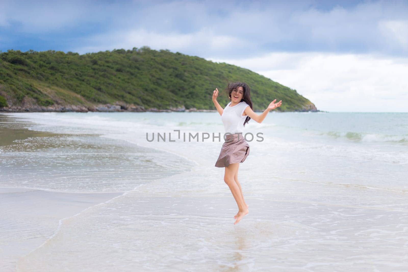 Beautiful Asian woman vacation on beach of Thailand.