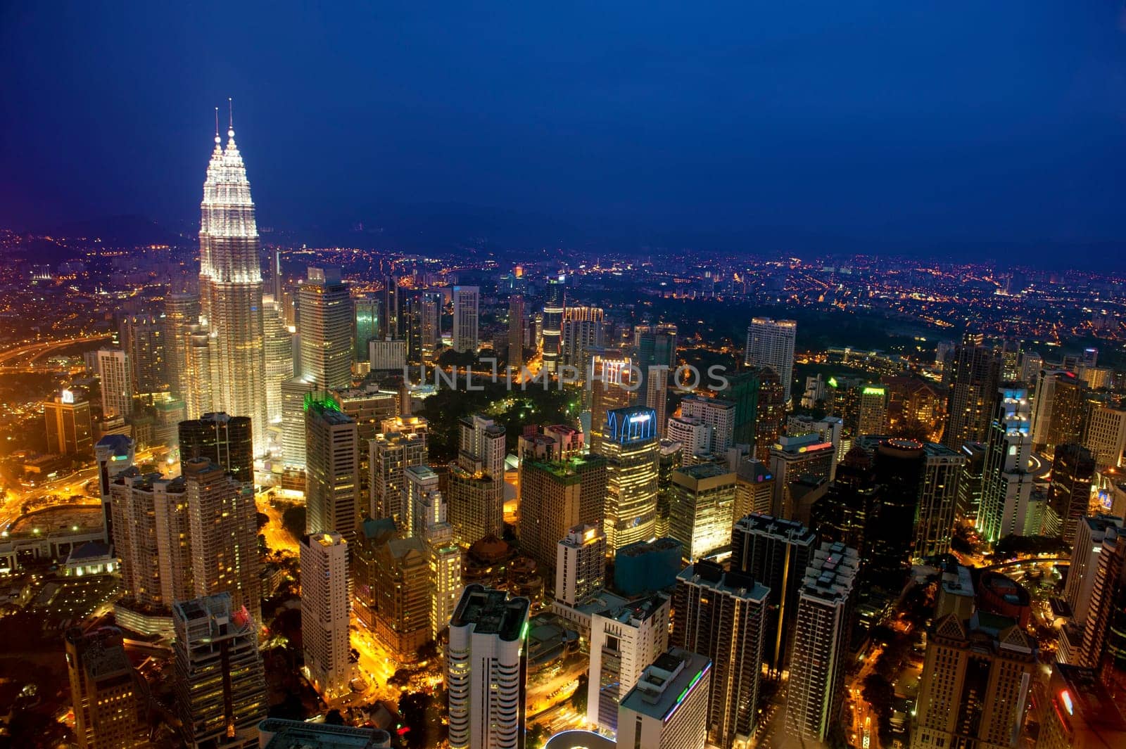 Sunset Aerial View with blue sky of Kuala Lumpur skyline, capital city Malaysia.