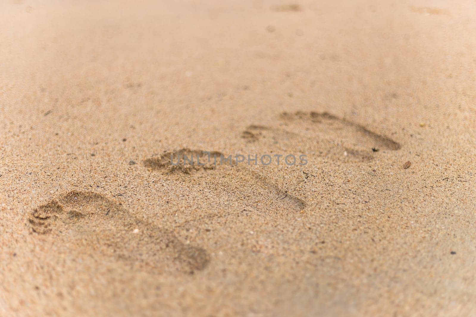 Closeup of sand pattern of a beach in the summer