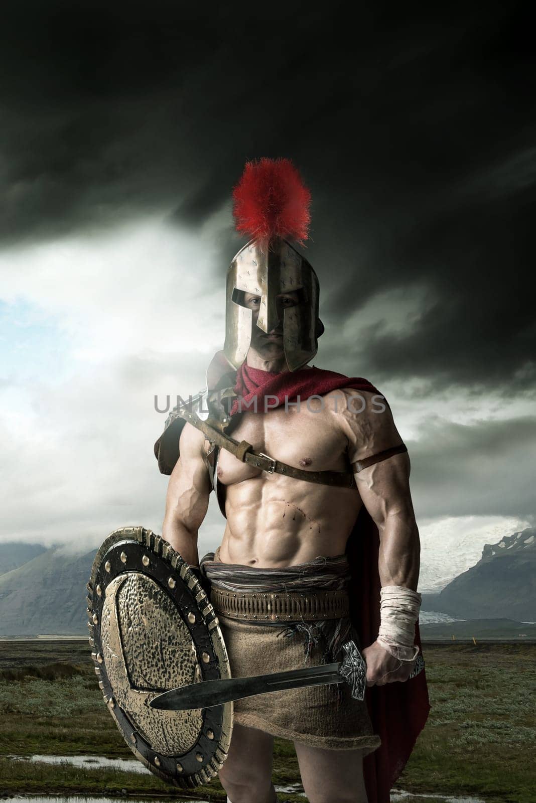 Ancient warrior or Gladiator posing outdoors with helmet