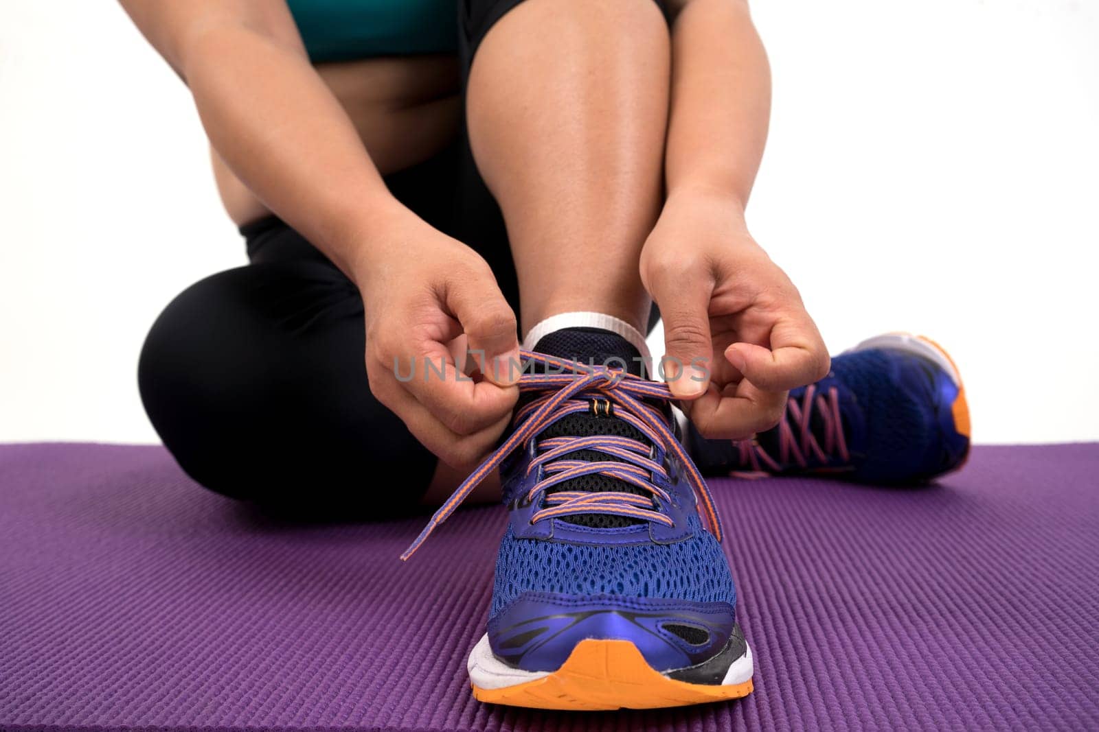chubby woman doing fitness on white background